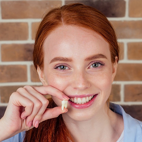 patient smiling after tooth extraction in Holliston