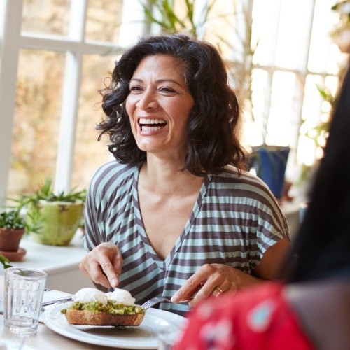 Woman with dental implants laughing