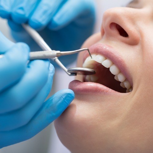 Patient receiving scaling and root planing periodontal therapy