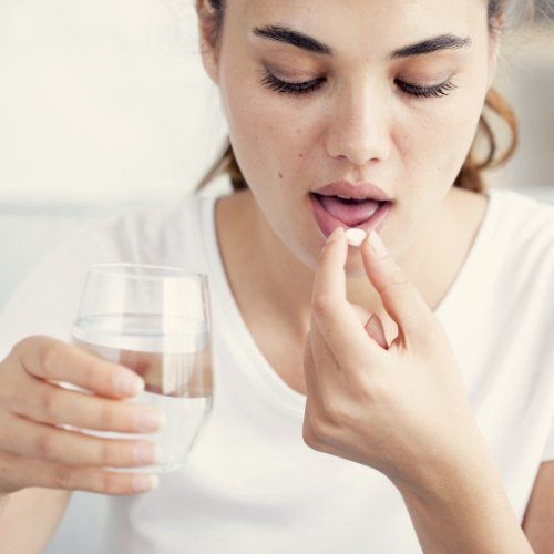 Person taking a pill