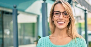 Woman with gorgeous smile after cosmetic dentistry